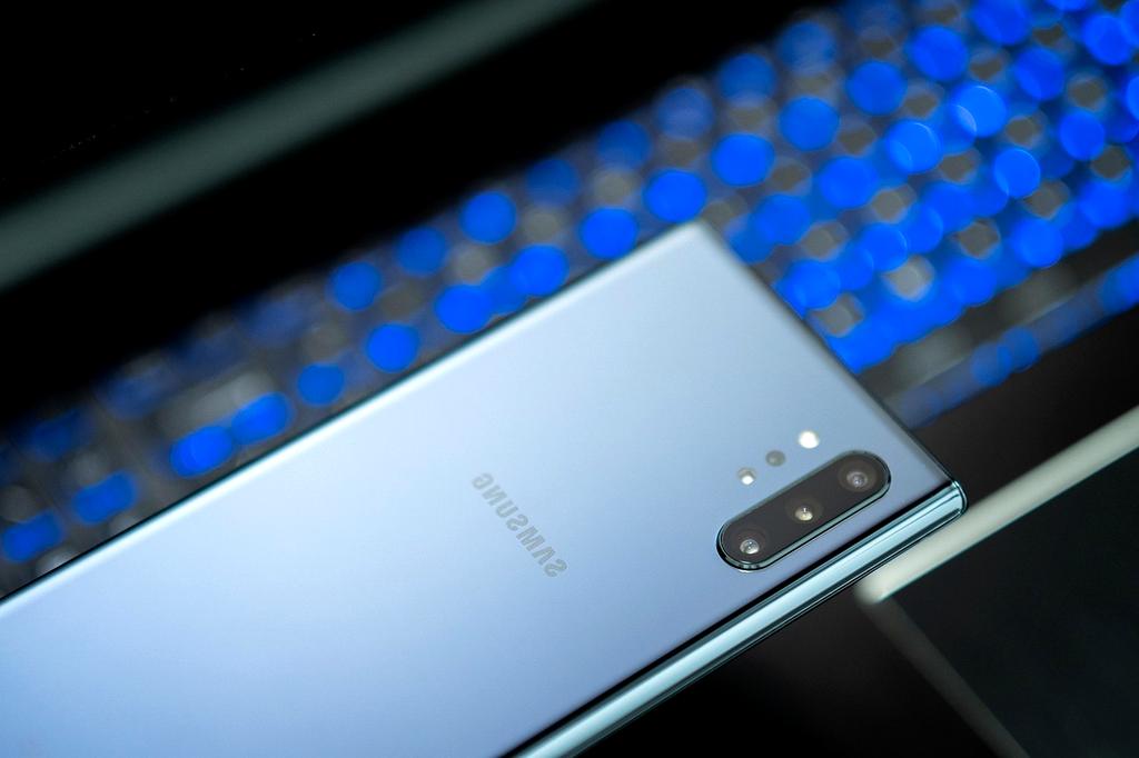 Modern digital workspace with laptop and notes